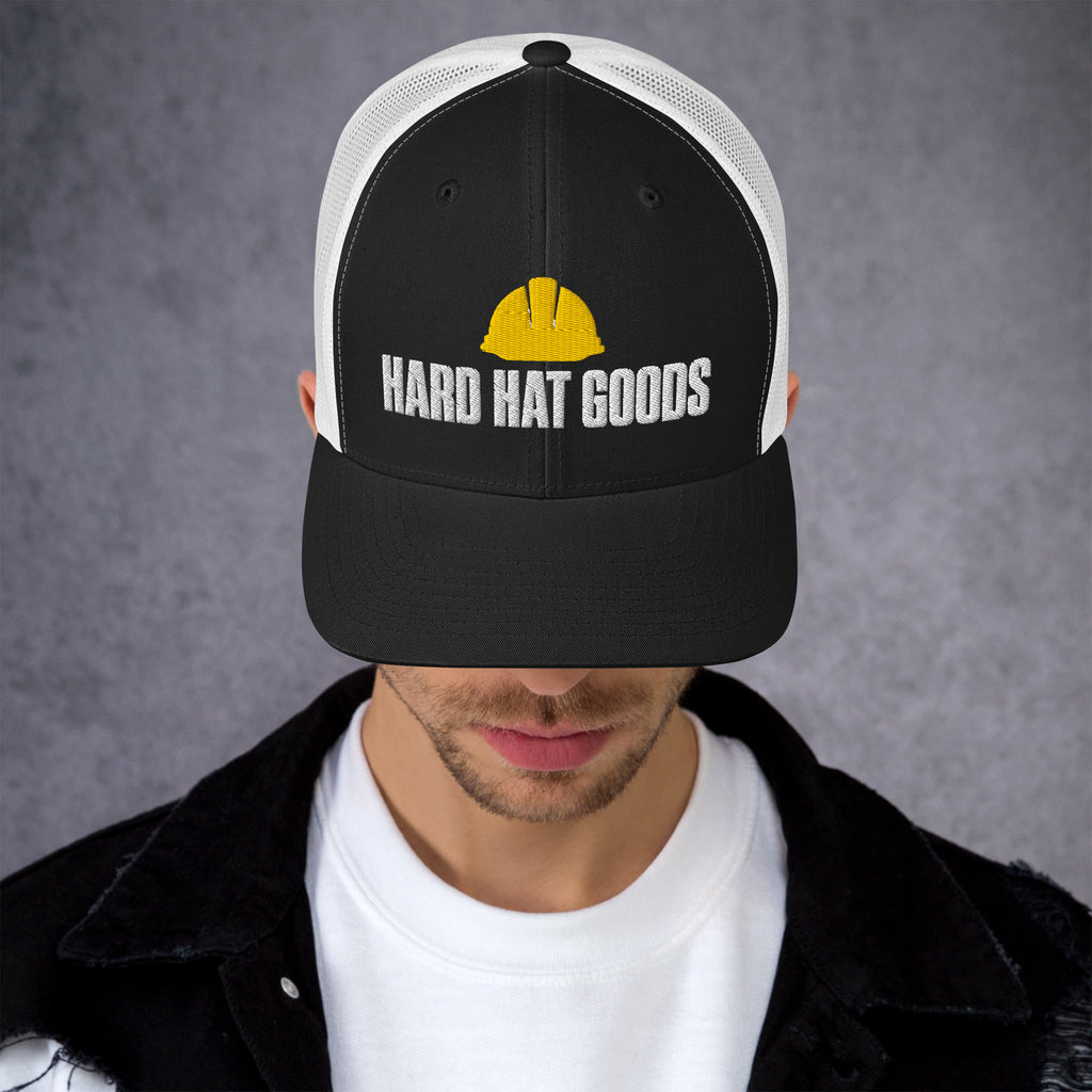 Black and white mesh trucker hat with embroidered Hard Hat Goods logo